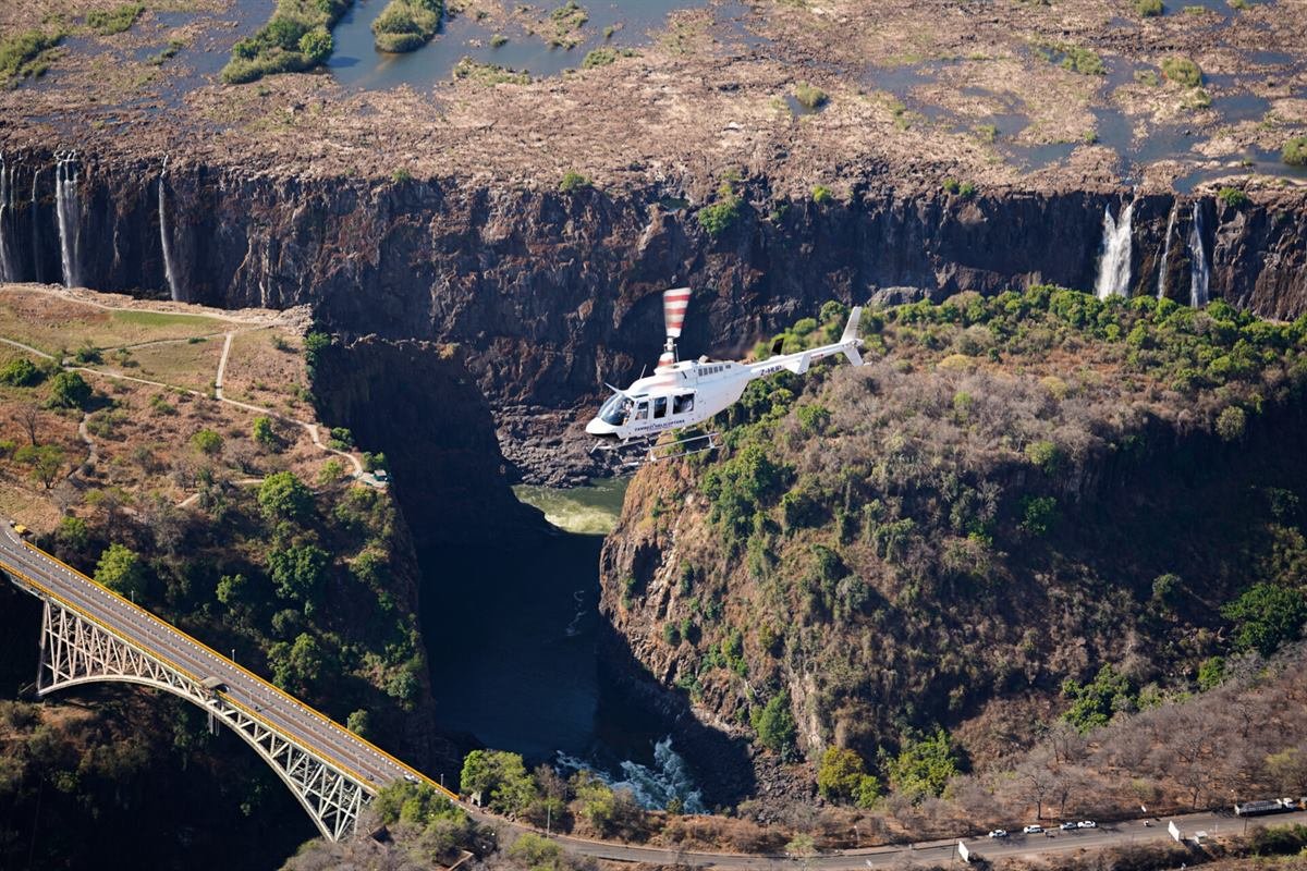 Helicopter banking over Victoria Falls and the Batoka Gorge on a Flight of Angels scenic tour