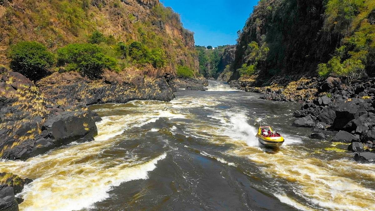 Jet boat spinning on the Zambezi River in the gorge below Victoria Falls