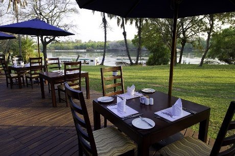 Riverside terrace dining at A'Zambezi River Lodge