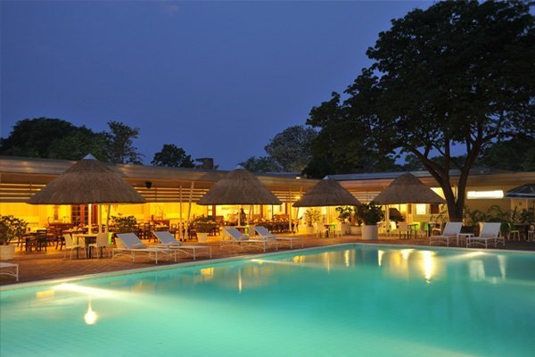 Swimming pool at Cresta Sprayview Hotel, Victoria Falls, at dusk
