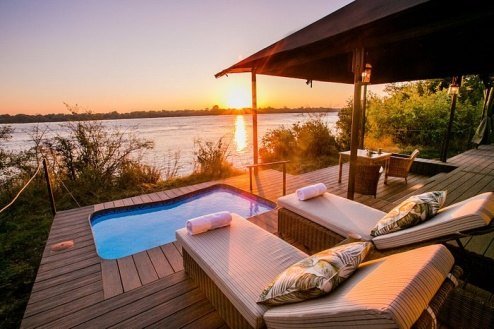 Private plunge pool and deck at sunset on the Zambezi, Old Drift Lodge