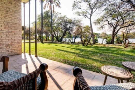 Terrace view over the lawns to the Zambezi at Palm River Hotel
