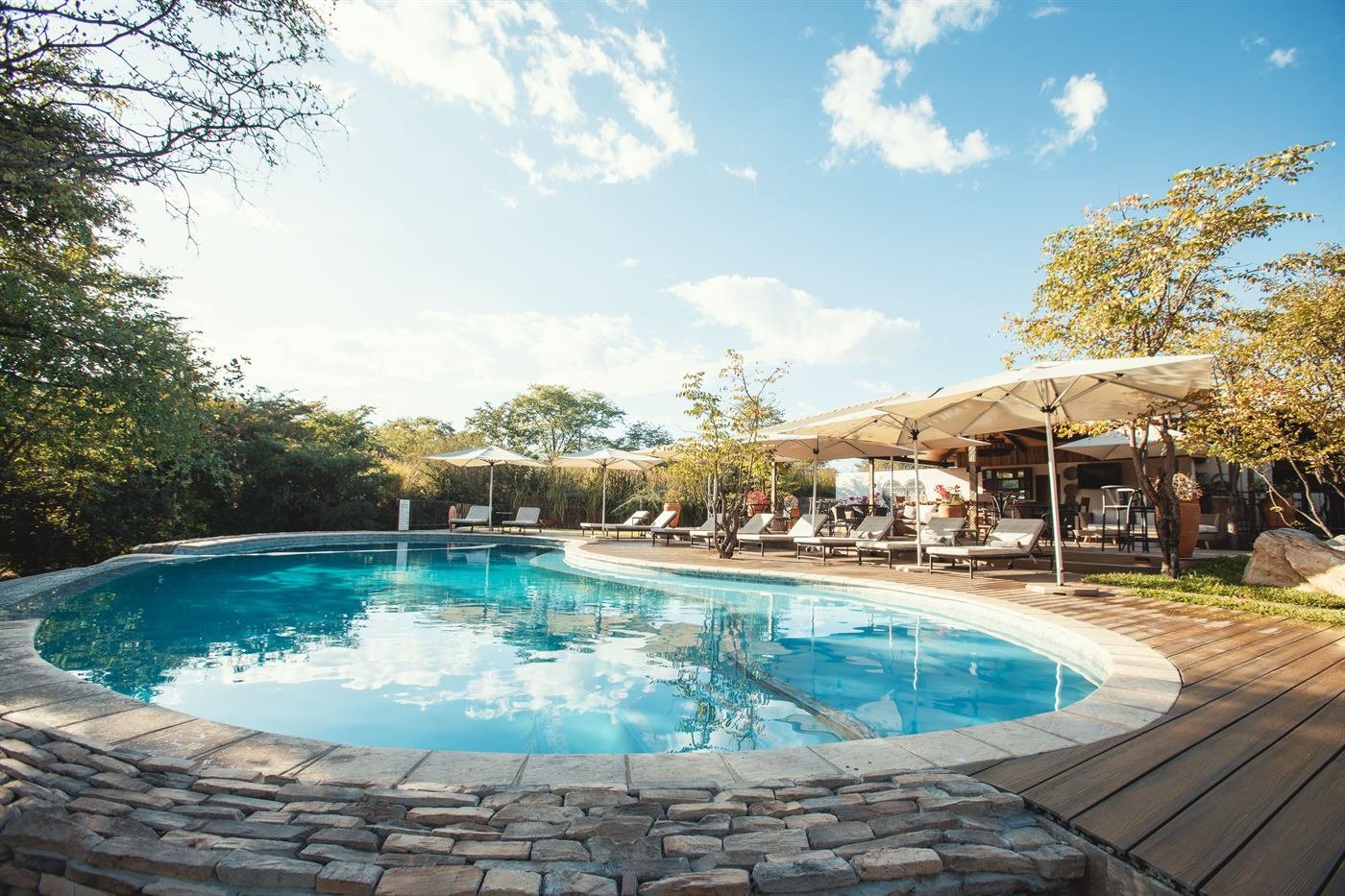 Pool deck and loungers at a lodge on the Zimbabwe Eastern Circuit