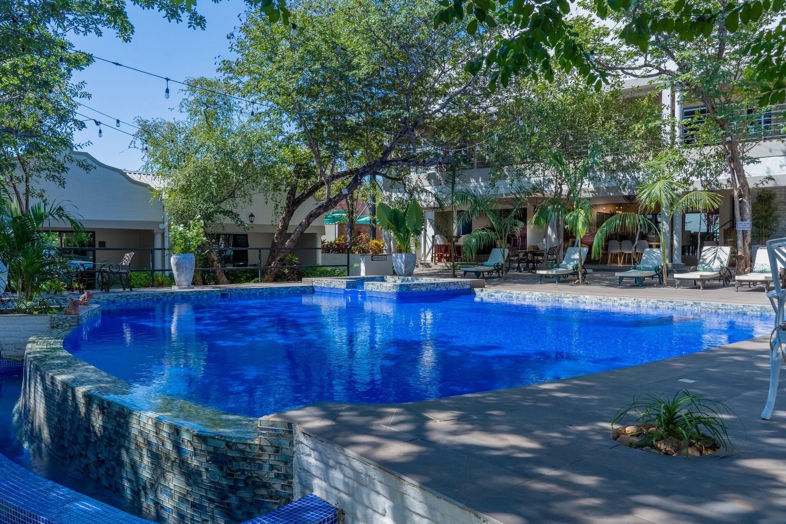 Swimming pool and gardens at Kasambezi Lodge, Victoria Falls