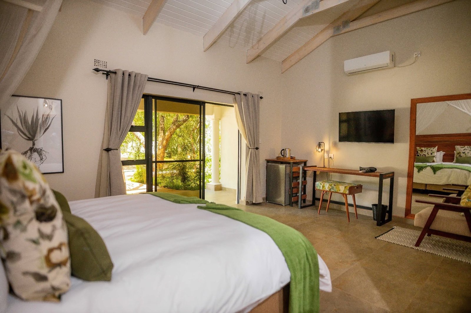 Deluxe room opening onto the garden at Kasambezi Lodge