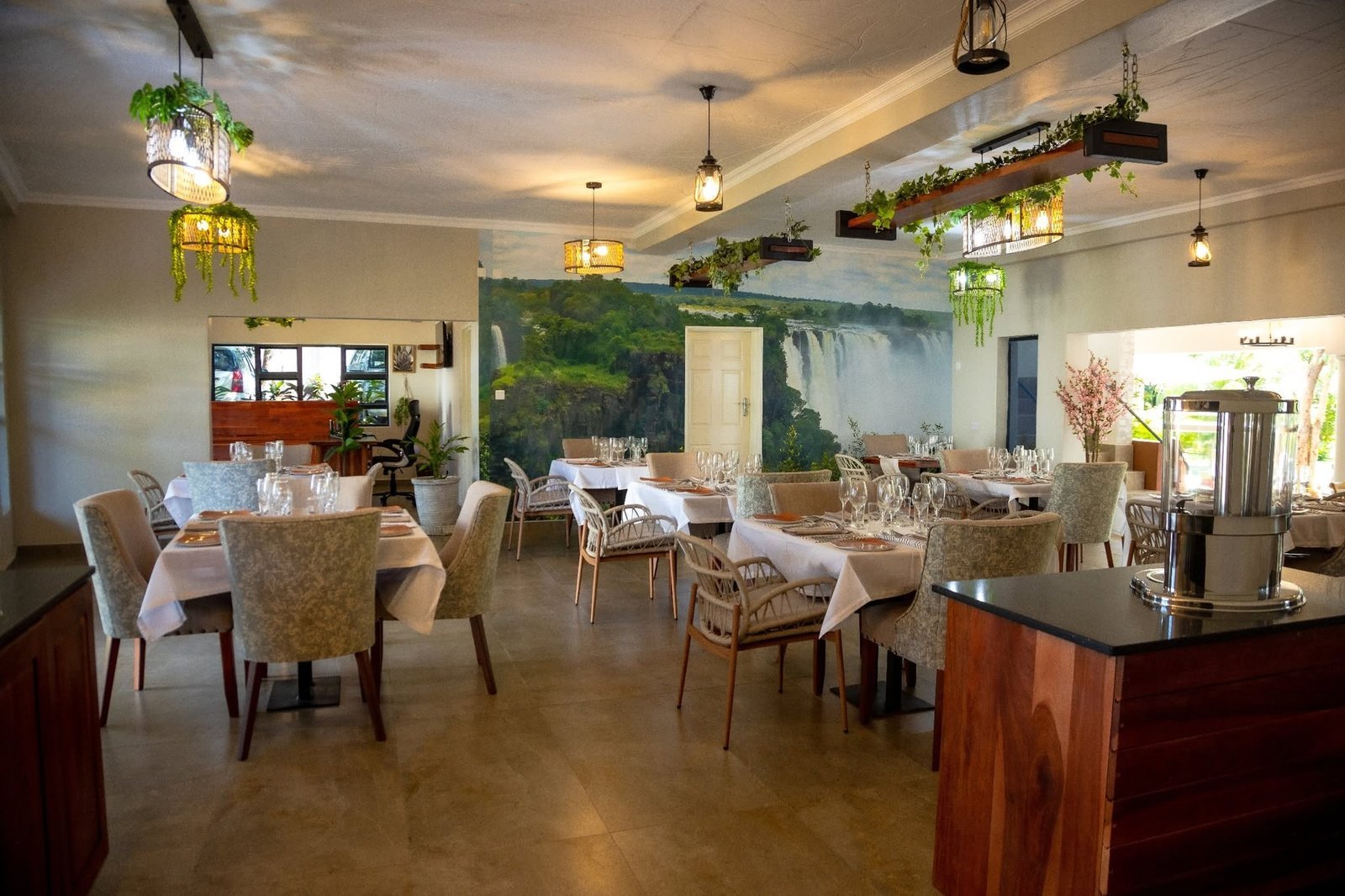 Restaurant laid for dinner at Kasambezi Lodge