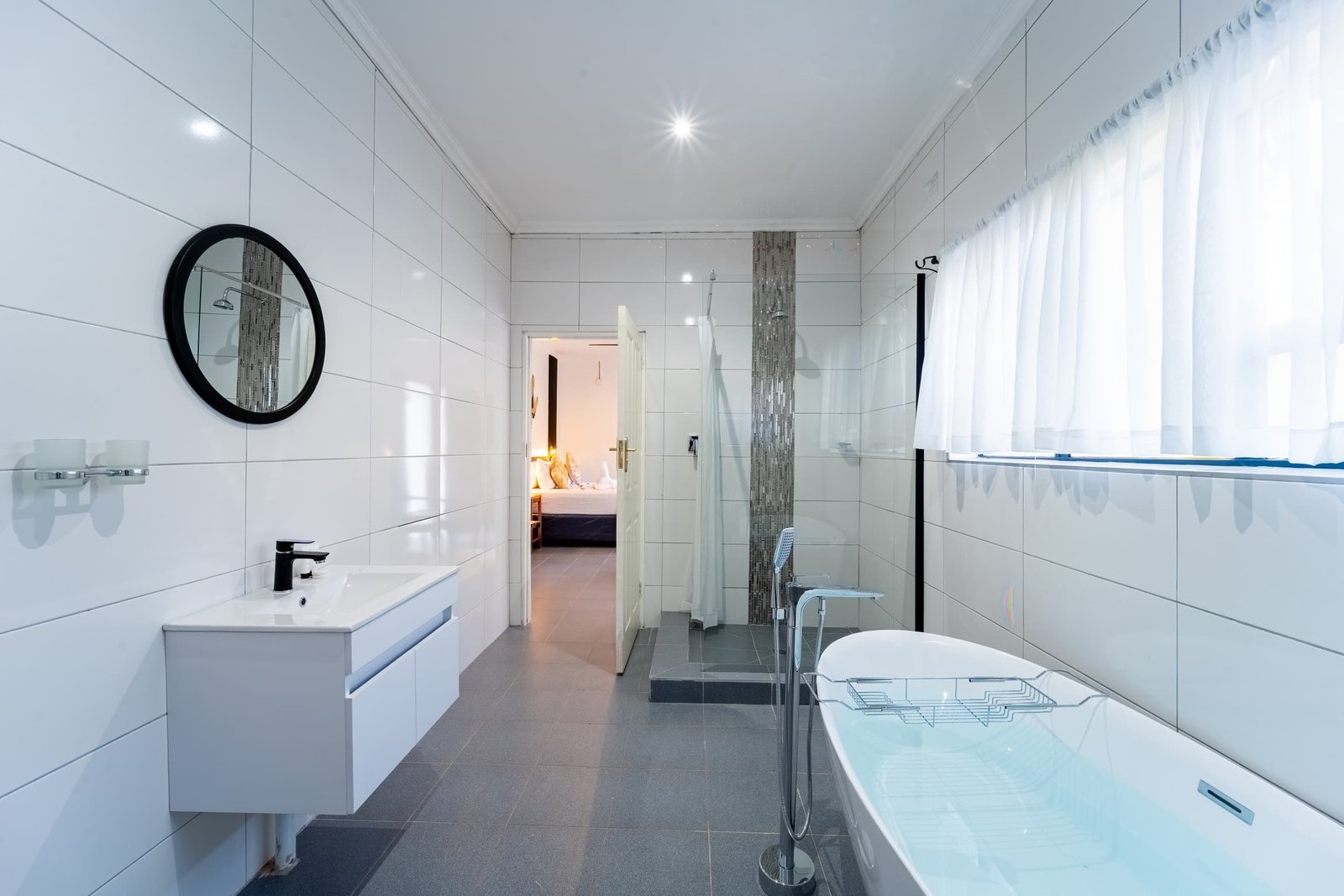 Bathroom with a bath and walk-in shower at Murugare