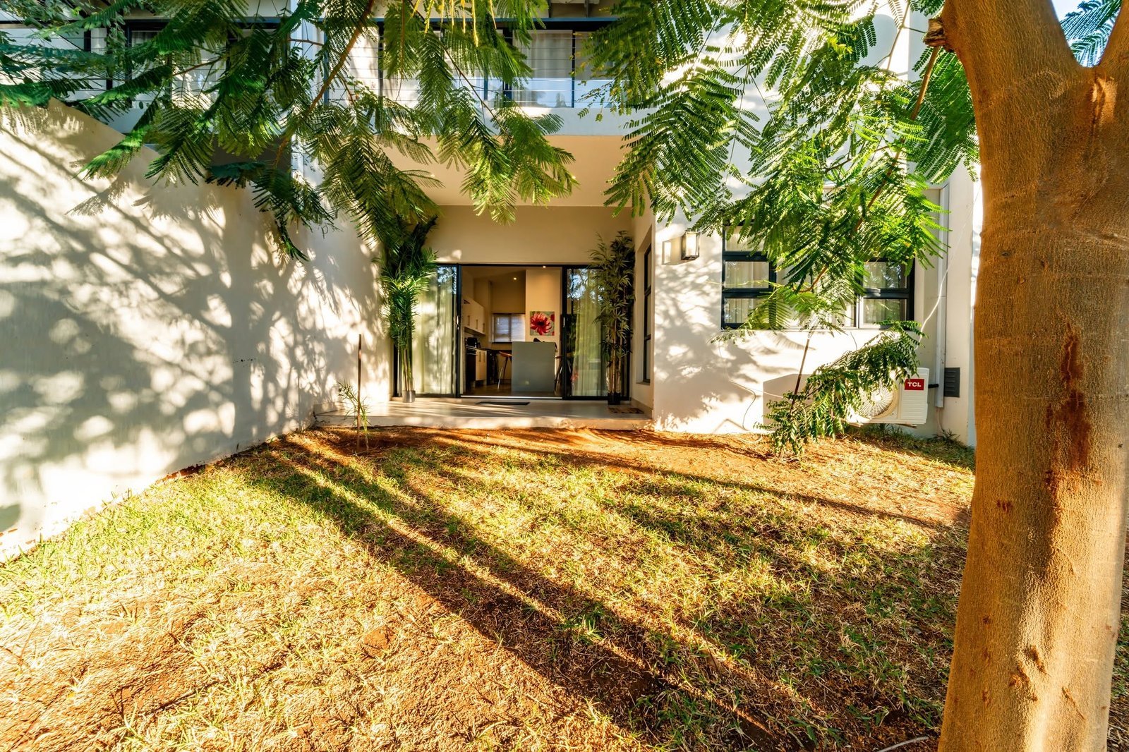 Shaded garden at 53 Reynard Apartments, Victoria Falls