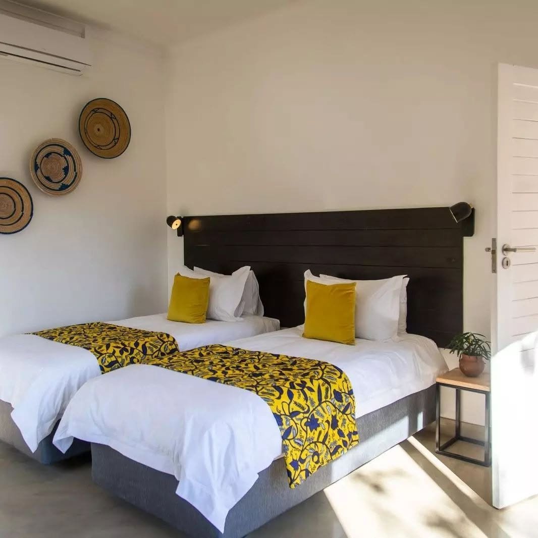 Twin room with artisan decor at Tabokana House
