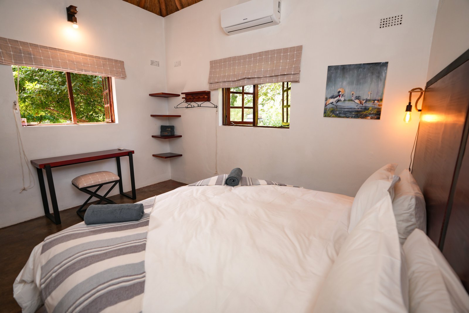 Double room with a stone feature wall at The Outlook Lodge
