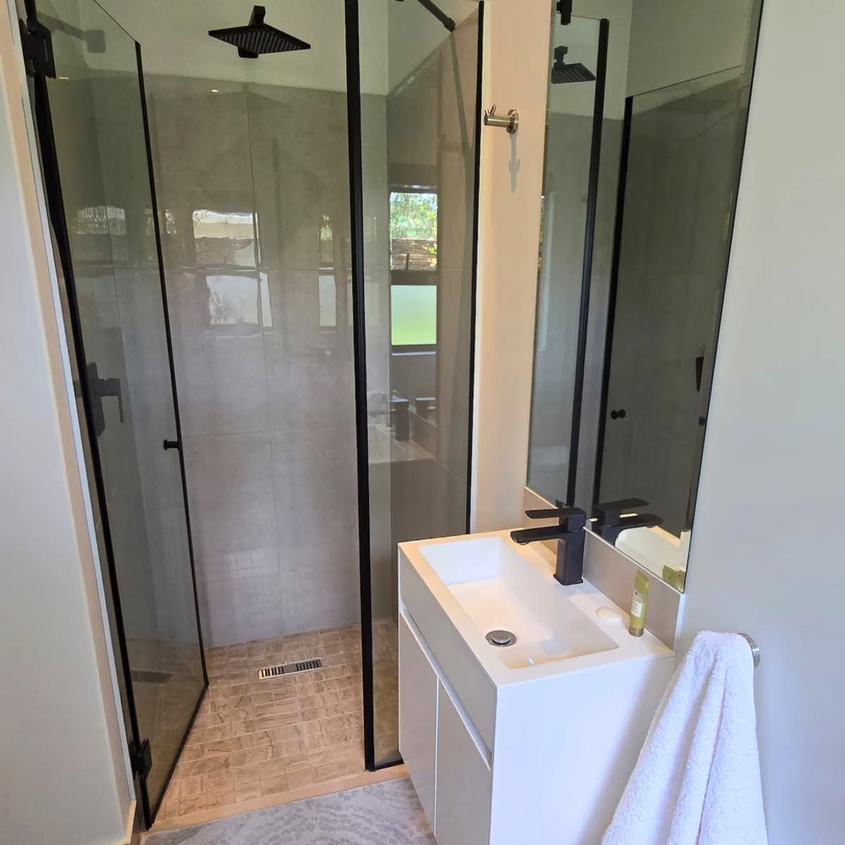 Bathroom with walk-in shower at The Outpost