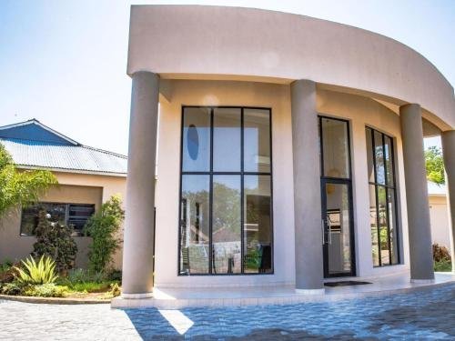 Curved exterior of The Telescope Boutique Lodge, Victoria Falls