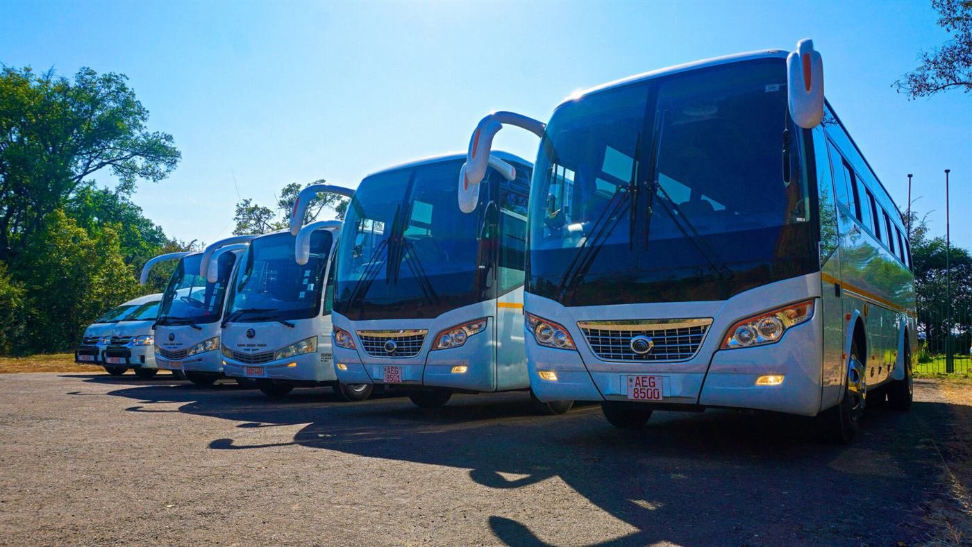 Victoria Falls Tours and Safaris transfer vehicle on the road to Victoria Falls Airport
