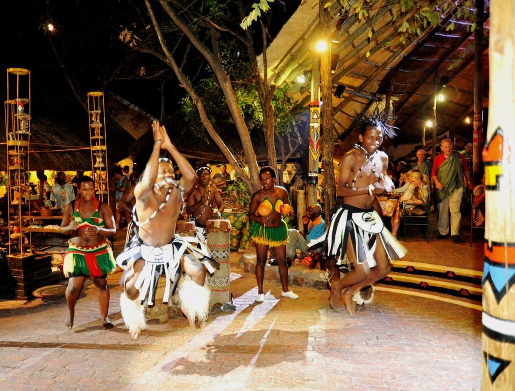 Dancers performing in traditional dress at The Boma dinner and drum show