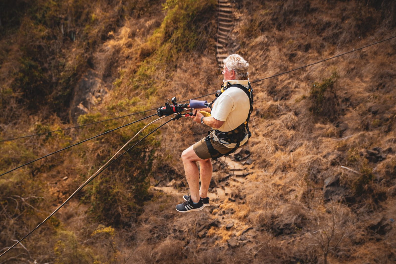 A bridge swing rider out over the rocks of the Batoka Gorge