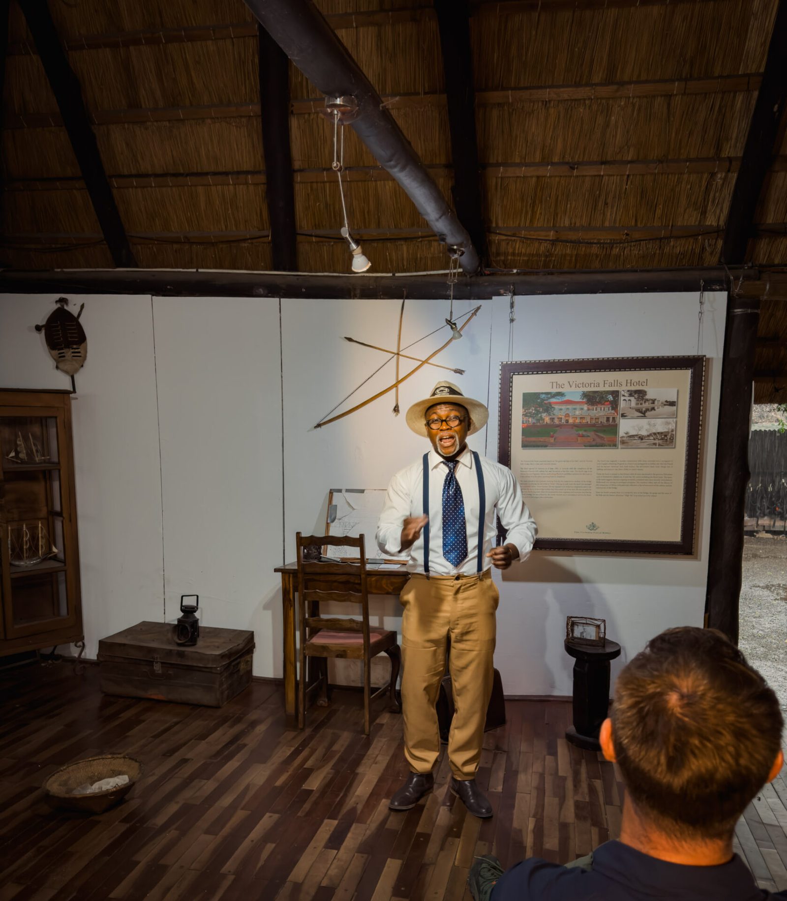 A guide in period dress telling the story of the 1905 bridge