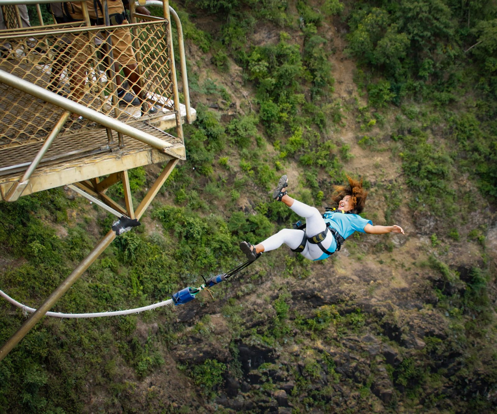 A bungee jumper falling from the Victoria Falls Bridge towards the Zambezi