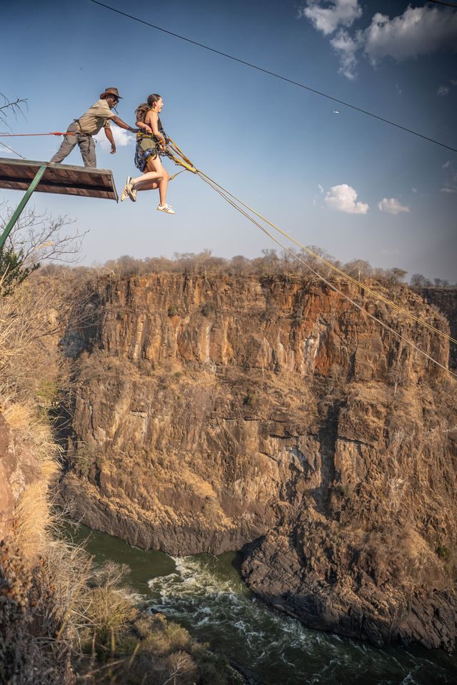 A gorge swing jumper high above the Zambezi in the Batoka Gorge