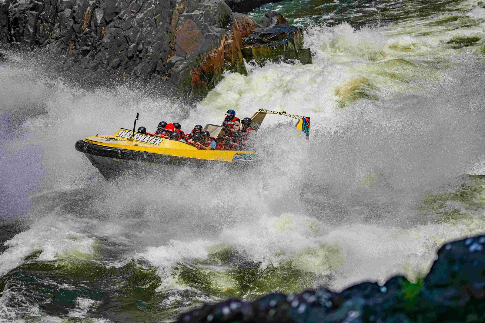 Jet boat throwing spray on the Zambezi below Victoria Falls