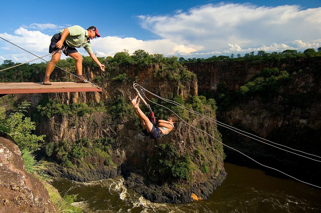 Gorge swing jumper launching from the cliff platform over the Batoka Gorge