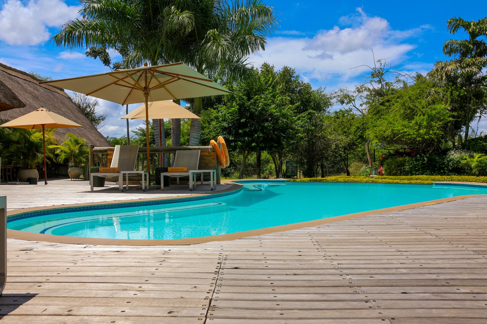Swimming pool and shaded deck at Explorers Village, Victoria Falls