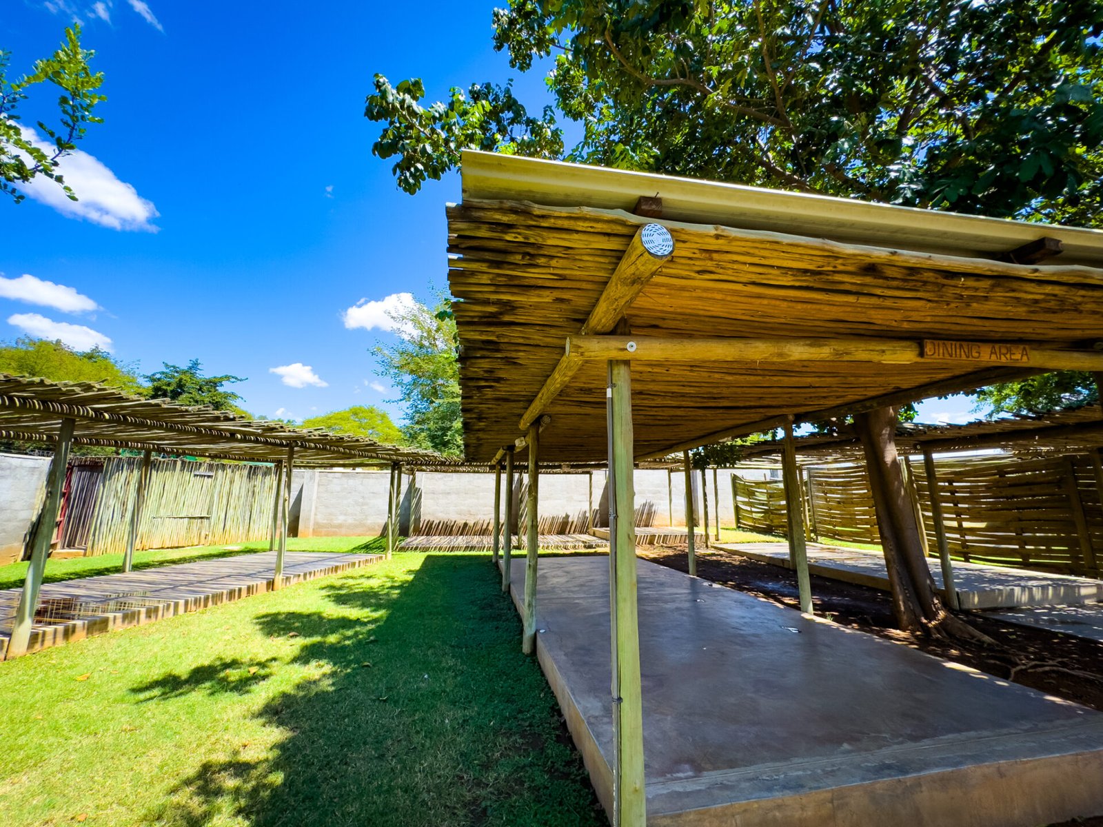 Shaded camping shelters at Explorers Village