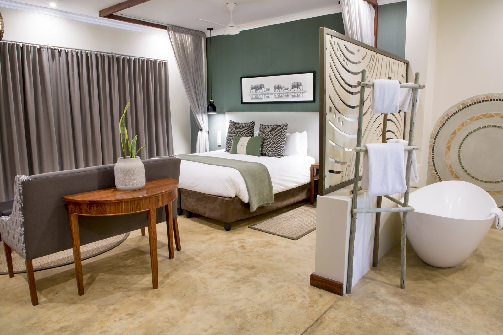 Signature room with a freestanding bath at Insika Lodge