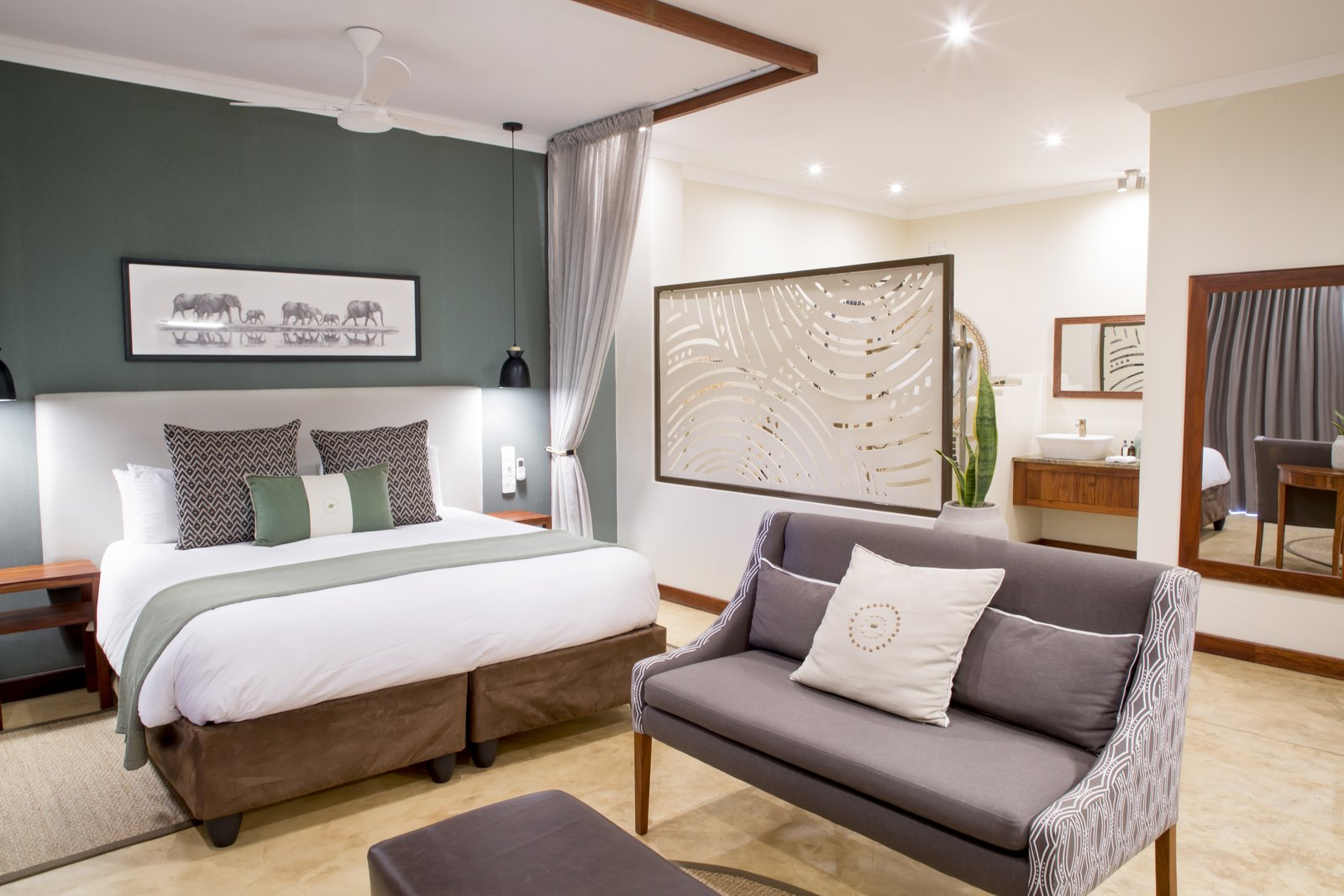Signature room with a sitting area at Insika Lodge