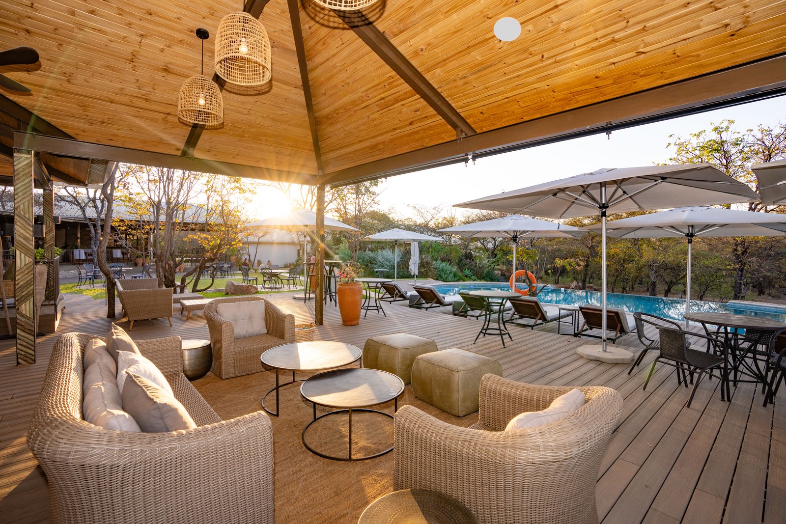 Shaded deck seating overlooking the pool at Insika Lodge