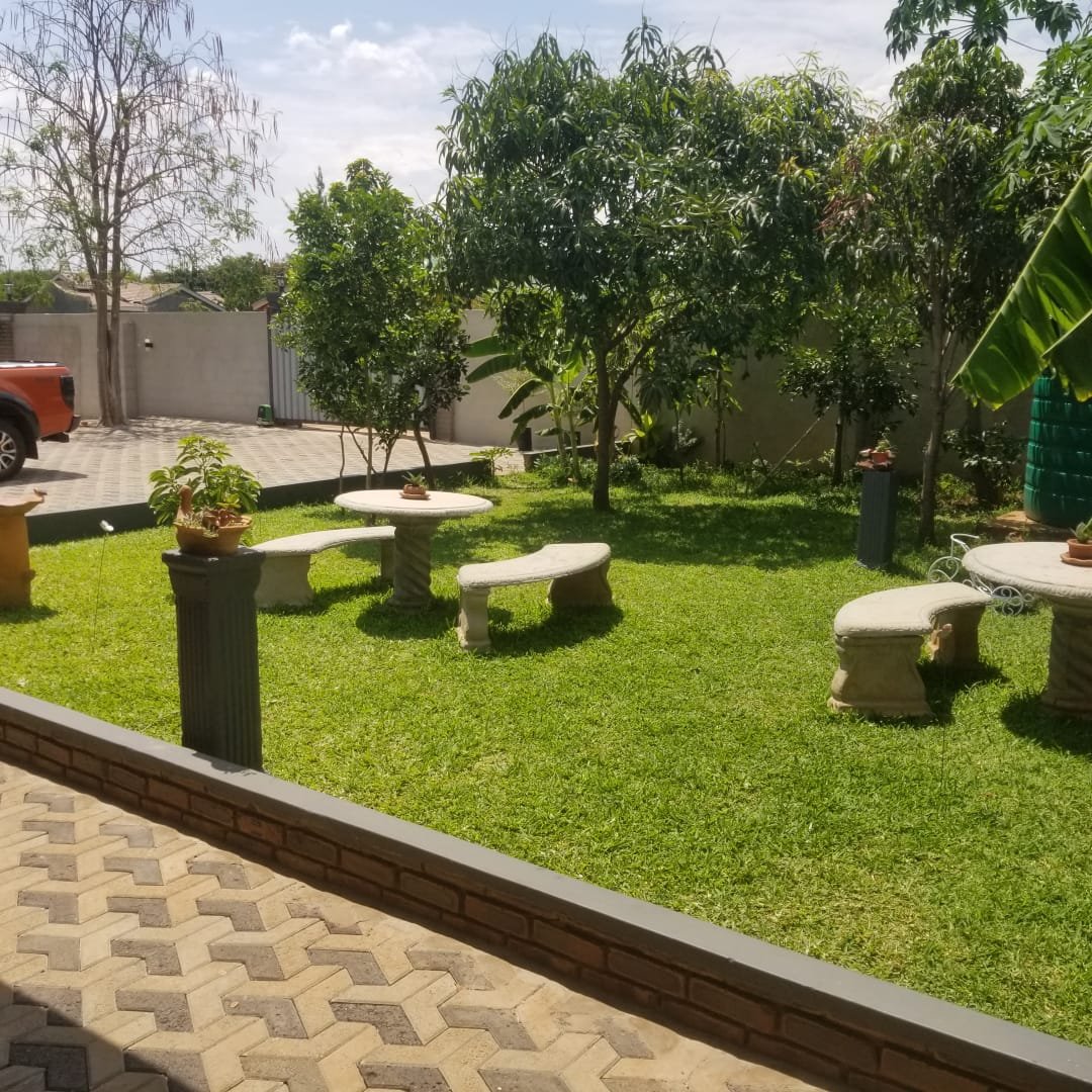 Rupiya House and its paved driveway