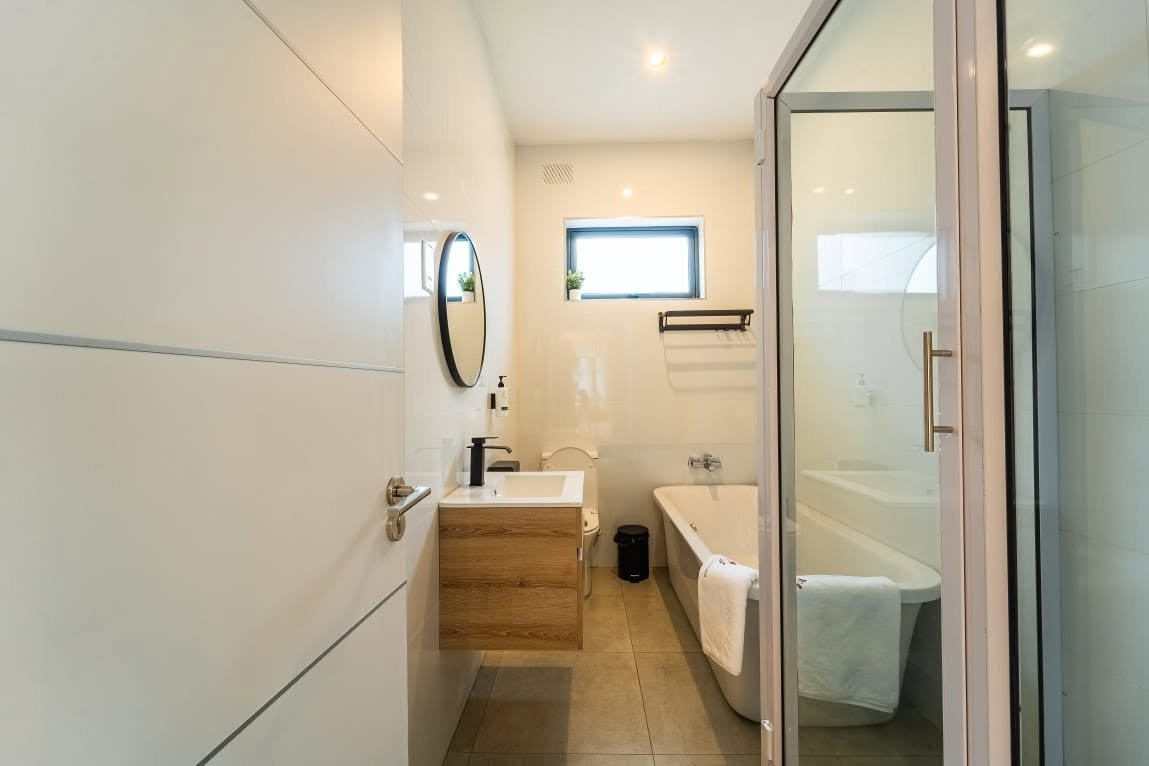Bathroom with a bath and separate shower at Sea of Dreams apartments